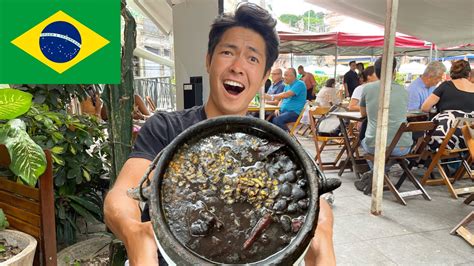 Japanese guy tries Feijoada Brazils national dish for the first time in Rio de Janeiro